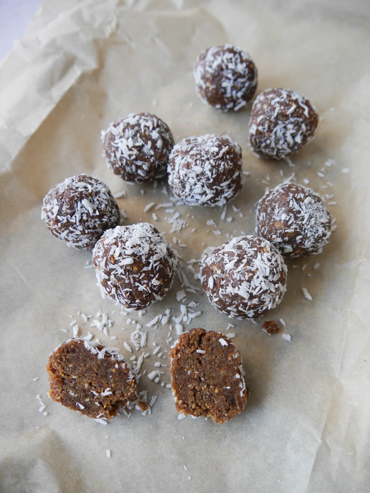 Paper lined tray topped with peanut butter energy balls.